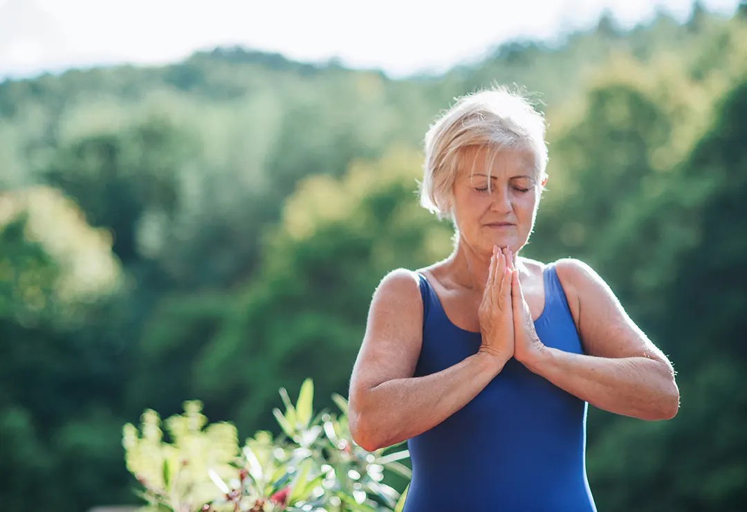 woman meditating in nature